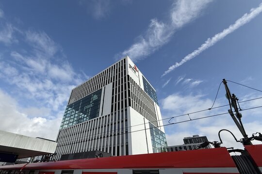 Munich, Germany &ndash; Aug. 03, 2025: facade of the modern glass-steel building of the "PricewaterhouseCoopers GmbH" auditing company ("PwC") with logo at the start of the summer holidays in Bavaria
