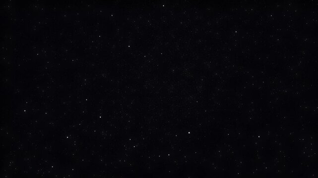 Wide field view of a starlit night sky with twinkling stars