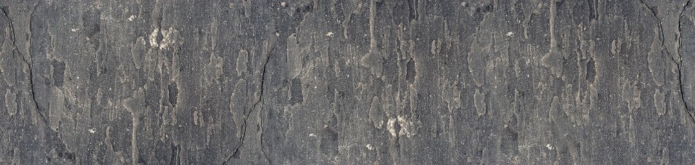 Dark Grey Cracked Concrete Surface with Weathered Grunge Texture and Distressed Industrial Pattern