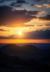 Obraz premium Harsh, dramatic sunrise casting intense fiery light through heavy morning clouds over rugged, desolate wilderness terrain, remote, powerful, orange