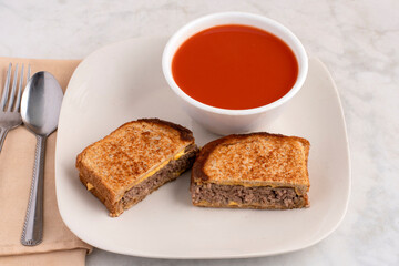 burger melt sandwich  with tomato soup