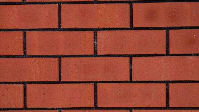 Red brick wall background. Full frame