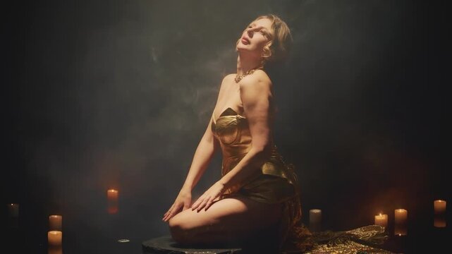 Beauty woman fashion model siitting in dark black water pool studio full smoke, magic light candles burning, blonde hair girl sexy body creative design royal fantasy golden armor dress fairy queen 4k