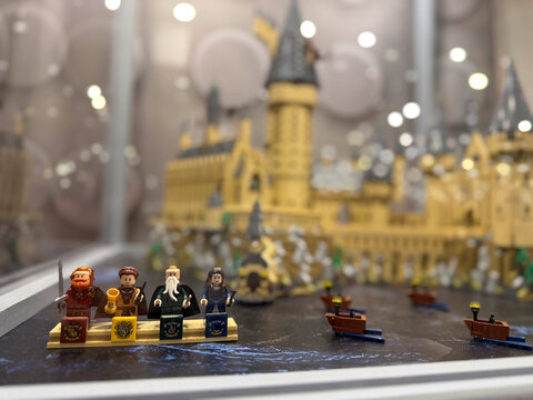 Lego minifigures on podiums with castle backdrop