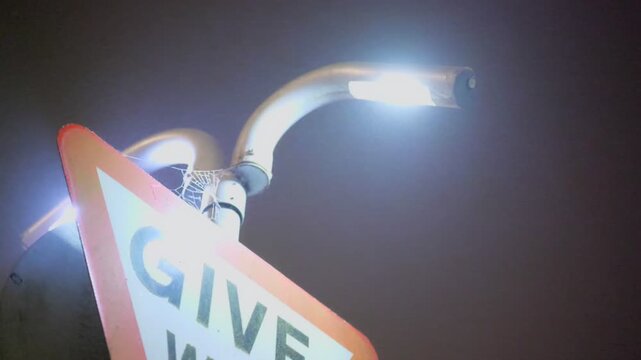 No access UK road sign, flashing faulty light. Cutaway shot. 