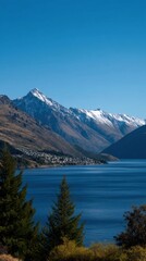 Scenic View of Queenstown Skyline and Serene Lake Wakatipu under Clear Blue Sky
