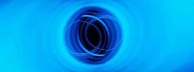 光沢感のある青い光の線が渦巻く抽象的な背景