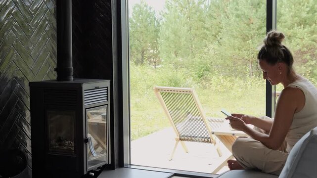 Quiet mental health moment woman using smartphone in private home space relaxation supports emotional reset relaxation improves calm thinking relaxation helps digital fatigue recovery process