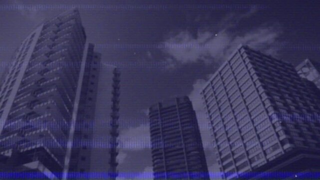 Animation of glitch effect against low angle view of tall buildings