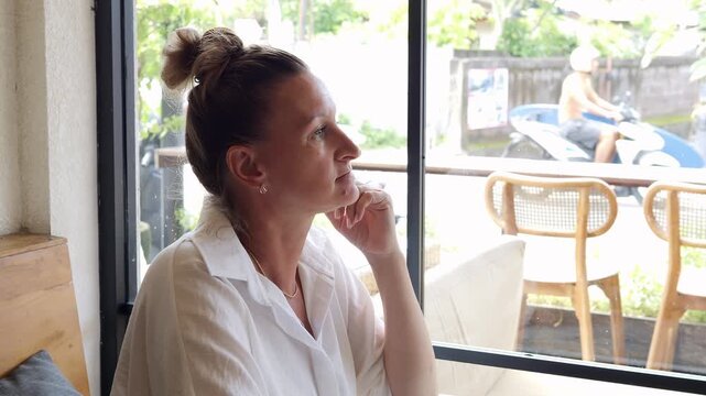 Daylight reflection of thoughtful woman near cafe window quiet reflection on life direction and meaningful choices Peaceful mood inspires reflection strengthens clarity reflection supports growth 