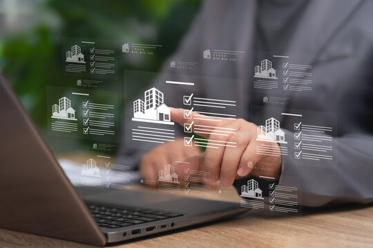 Real Estate management concept, Businessman Managing Real Estate Portfolio with Laptop Using Digital Checklist, Rating System to Improve Property Evaluation, Investment Planning,Transaction Efficiency