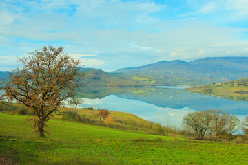Obraz premium Landscape of the Italian Apennines - Lake Montedoglio (Italian: Lago di Montedoglio), Tuscany, Italy