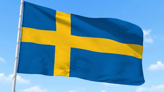 The Swedish flag waves in the air against a blue sky