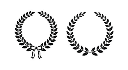 Obraz premium Two black and white laurel wreaths one with a ribbon displayed against a plain white background