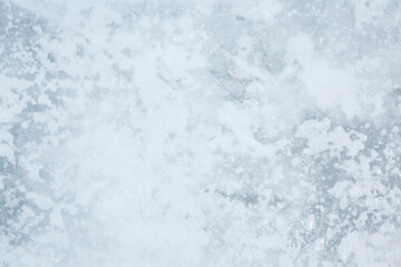 Obraz premium Snowy ice background. Closeup. Top down view.