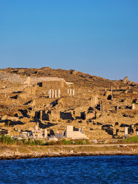 Waterfront of Delos Archaeological Site at sunset, Delos Island, Cyclades, Greece