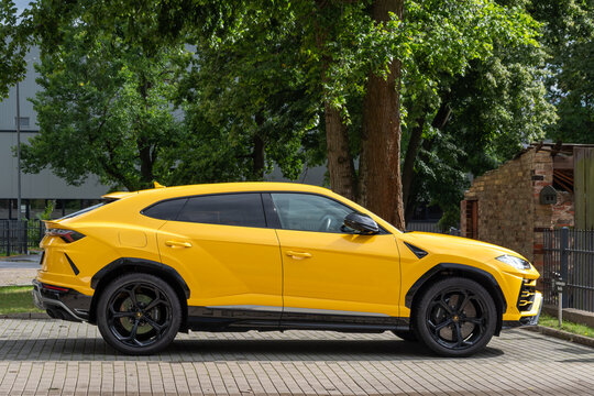 Side Profile of a Vibrant Yellow Lamborghini Urus Luxury SUV Parked in Berlin, Germany.