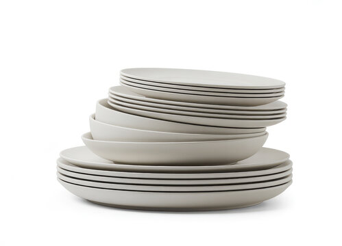 Stack of white plates and bowls with black lines stacked