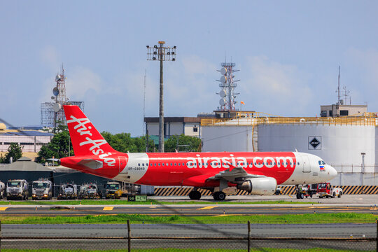 Manila, Philippines - 2025 July 13: A Philippines AirAsia Airbus A320 aircraft (RP-C8949) taxis on the taxiway at Ninoy Aquino International Airport under a clear sky.