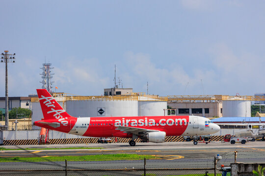 Manila, Philippines - 2025 July 13: A Philippines AirAsia Airbus A320 aircraft (RP-C8949) taxis on the taxiway at Ninoy Aquino International Airport under a clear sky.
