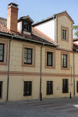 Building with windows and a tiled roof.. Royal Palace of La Granja de San Ildefonso, Spain