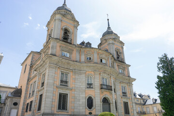 Obraz premium Historic building with towers and intricate architecture.. Royal Palace of La Granja de San Ildefonso, Spain