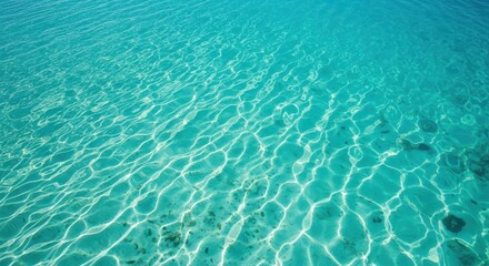 Obraz premium Pristine, vibrant turquoise tropical ocean water texture reflecting sunlight, showing clear visibility and natural sea purity, clean, surface, natural