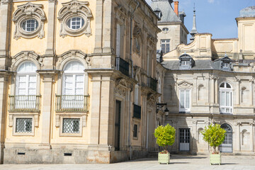 Fototapeta premium Historic architecture with decorative elements and greenery.. Royal Palace of La Granja de San Ildefonso, Spain