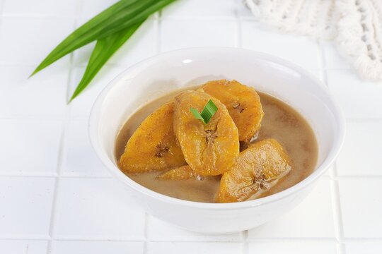 Traditional kolak pisang made from ripe banana cooked in coconut milk and palm sugar syrup. Popular Indonesian sweet dessert served warm.