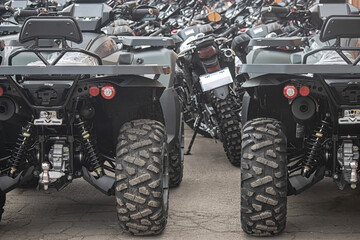 Row of new ATVs in a parking lot, rear view © Сергей Иванкин