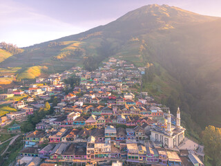 Obraz premium Aerial View panorama of colorful stack building houses in Nepal van Java village and Mount Sumbing, Java, Indonesia