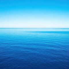 Obraz premium Vast, deep blue ocean water stretching toward the horizon under a clear summer sky, suggesting infinite maritime travel and exploration, vast, horizon, wide