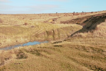 Naklejka premium A river running through a dry landscape