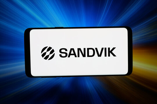 Stuttgart, Germany - 03-02-2026: In this photo illustration, the logo of Swedish engineering company Sandvik AB is displayed on a smartphone in front of abstract background on computer screen.