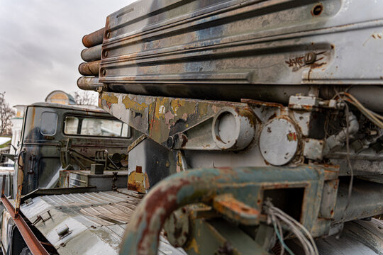 View of a weathered military truck with missile launcher, its paint peeling and rust forming, stands silently against a cloudy sky, Kyiv, Kyiv, Ukraine.