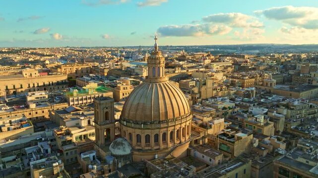 Drone sunset view of Valletta city, capital of Maltese island. Sunset, church