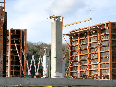 View of the construction site with orange frames, concrete pillars under a blue sky, a symphony of human endeavor against nature's canvas, Istanbul, Istanbul, Turkey.