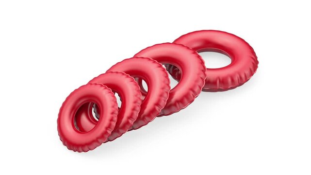 Group of red swim rings in different sizes on white background