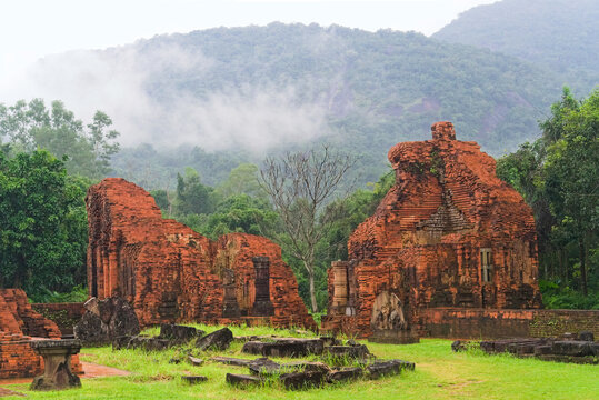 Ancient Champa civilization brick ruins at My Son Sanctuary under misty mountains in December, Quang Nam, Vietnam