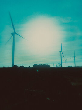wind turbines at sunset