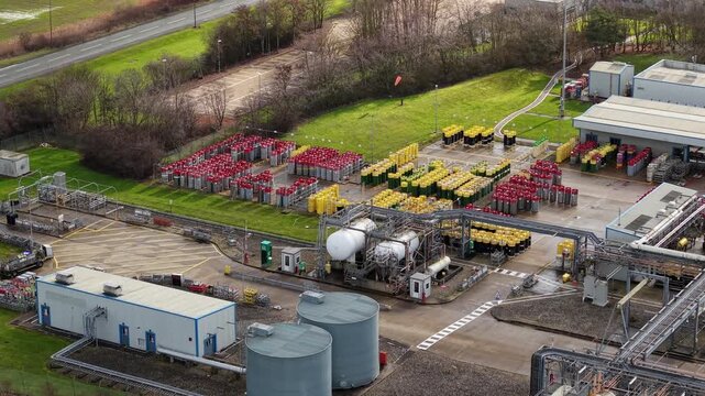 Aerial view of the BOC Gases facility displaying the tanks and cylinders creating a contrast with the surrounding greenery, Grimsby, United Kingdom.