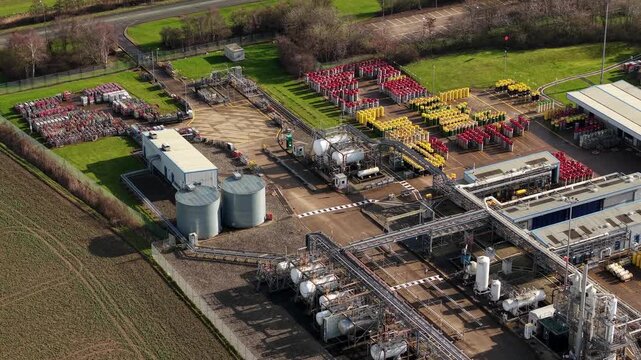 Aerial view of BOC Gases, showcasing the industrial landscape with tanks and cylinders, contrasting with the green fields, Grimsby, United Kingdom.