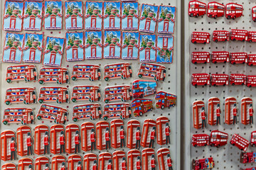 Obraz premium London, UK, December 13, 2025, Collection of colorful London souvenir magnets featuring double decker buses and telephone booths.