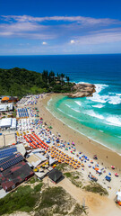 Obraz premium Tropical Beach Summer Scene Joaquina Florianopolis Brazil Ocean Waves Sand Dunes People Umbrellas Surf Destination Scenic Coastal Landscape Santa Catarina South America Travel Vacation Nature Rocks