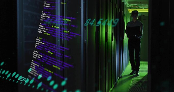 Standing Korean IT tech in dark uniform checking laptop at server aisle, projected code, copy space