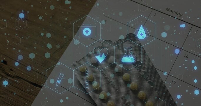 Displaying blister pack of yellow pills resting on Monday calendar on tabletop, with medical icons