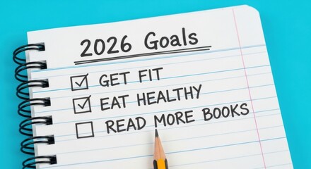 Obraz premium Hand-drawn 2026 personal goals list on a spiral notepad with checkmarks indicating progress.