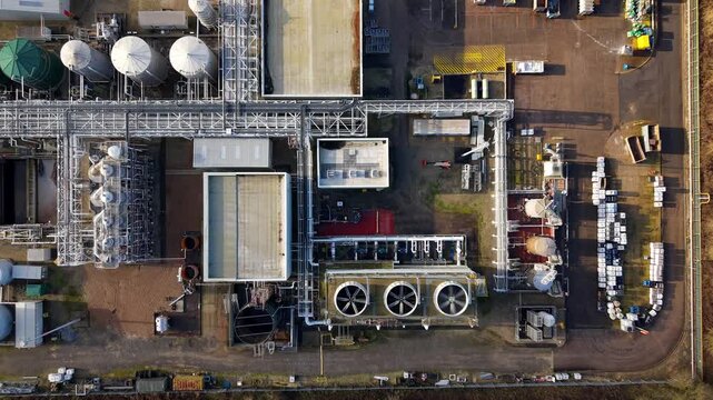 Aerial view of Lenzing Fibers Grimsby showing industrial buildings, tanks, and equipment under soft sunlight, Grimsby, England, United Kingdom.