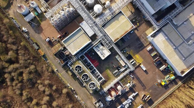 Aerial view of the Lenzing Fibers Grimsby, a sprawling industrial complex with silver tanks and stark white buildings, Grimsby, England, United Kingdom.