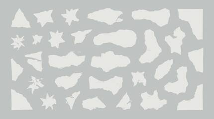 Collection of assorted white abstract shapes on gray background.